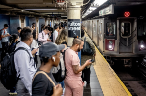 people waiting for the subway in NYC