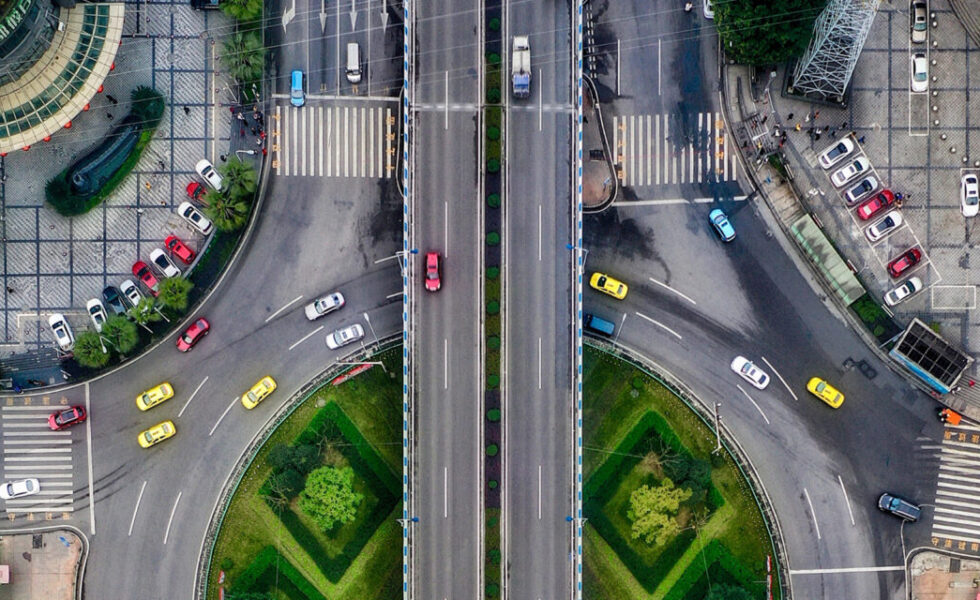 aerial photo of cars driving through a roundabout