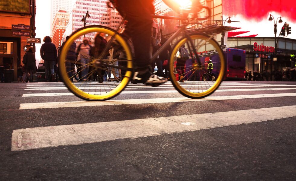a bike passing over a ped. walkway in NYC