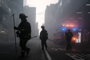 FDNY fire fighters walking a smoky street