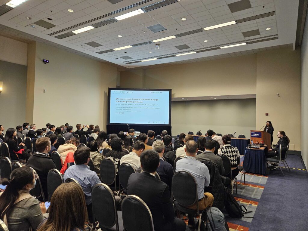 Farnoosh giving her presentation in front of a full audience