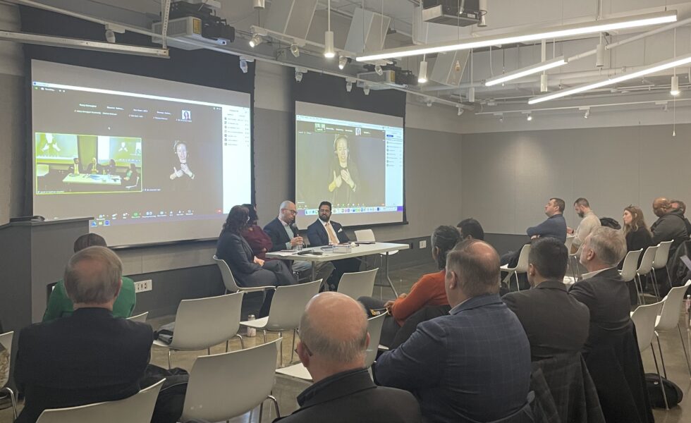 image of the panel and some audience members