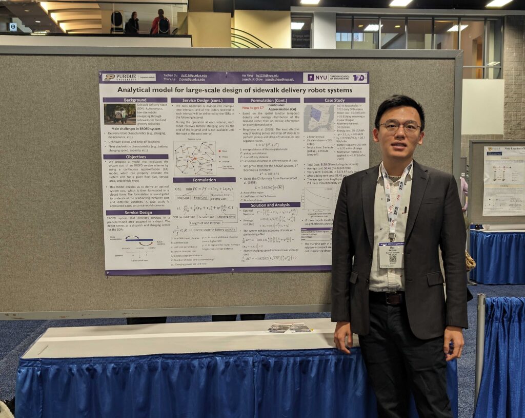 Hai in front of his poster