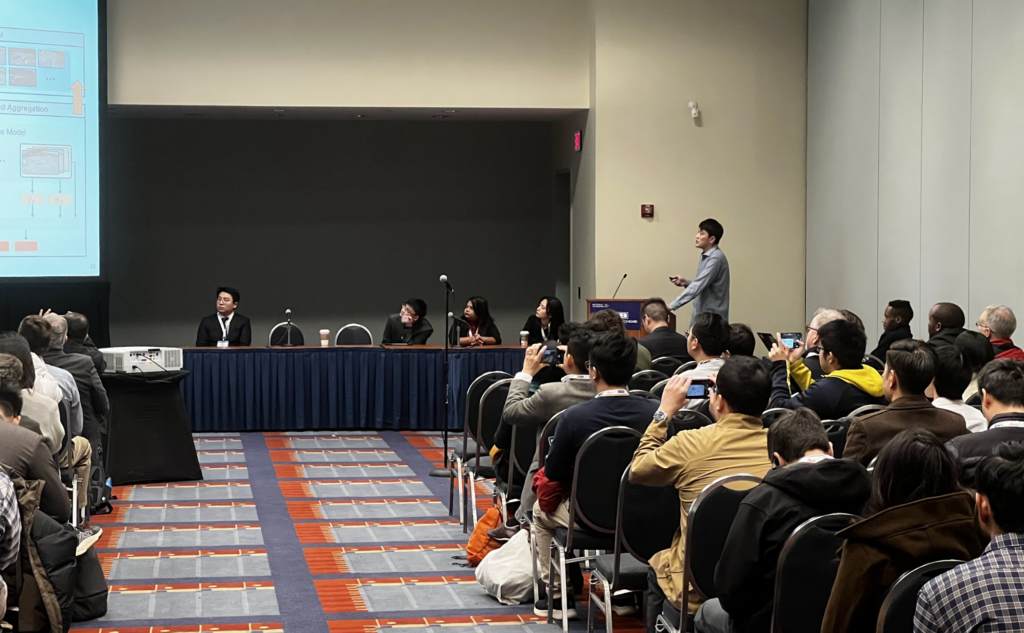 Ruixuan Zhang presenting to a full conference room at TRB