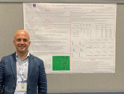 Batin in front of his poster