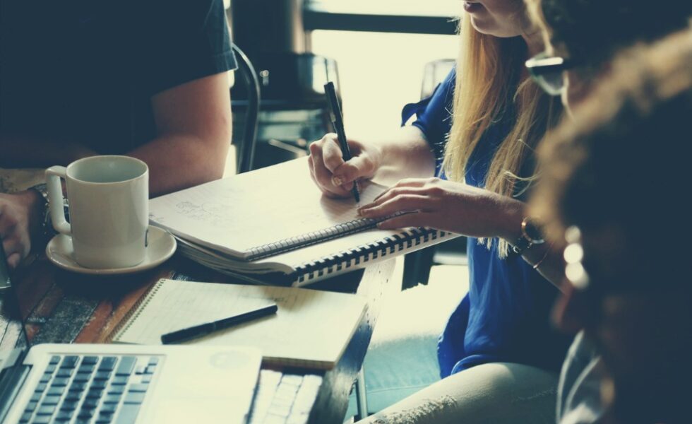 students working at a desk together