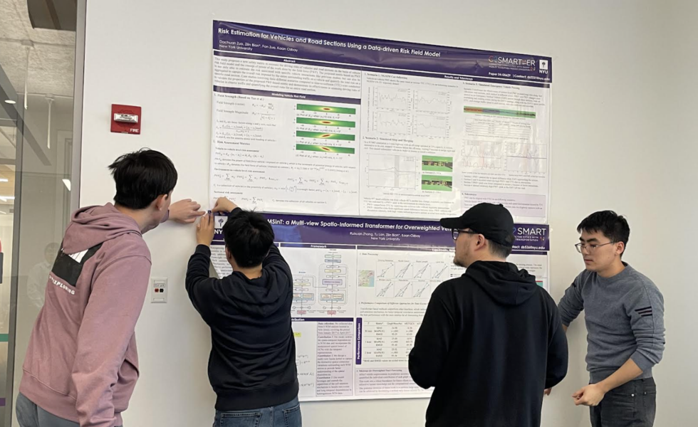 NYU student researchers hanging up posters