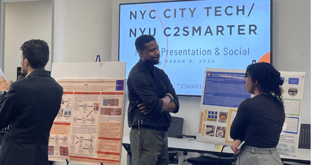 researchers talking in front of posters