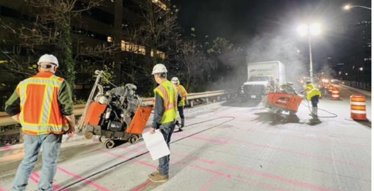 construction crew working on BQE at night