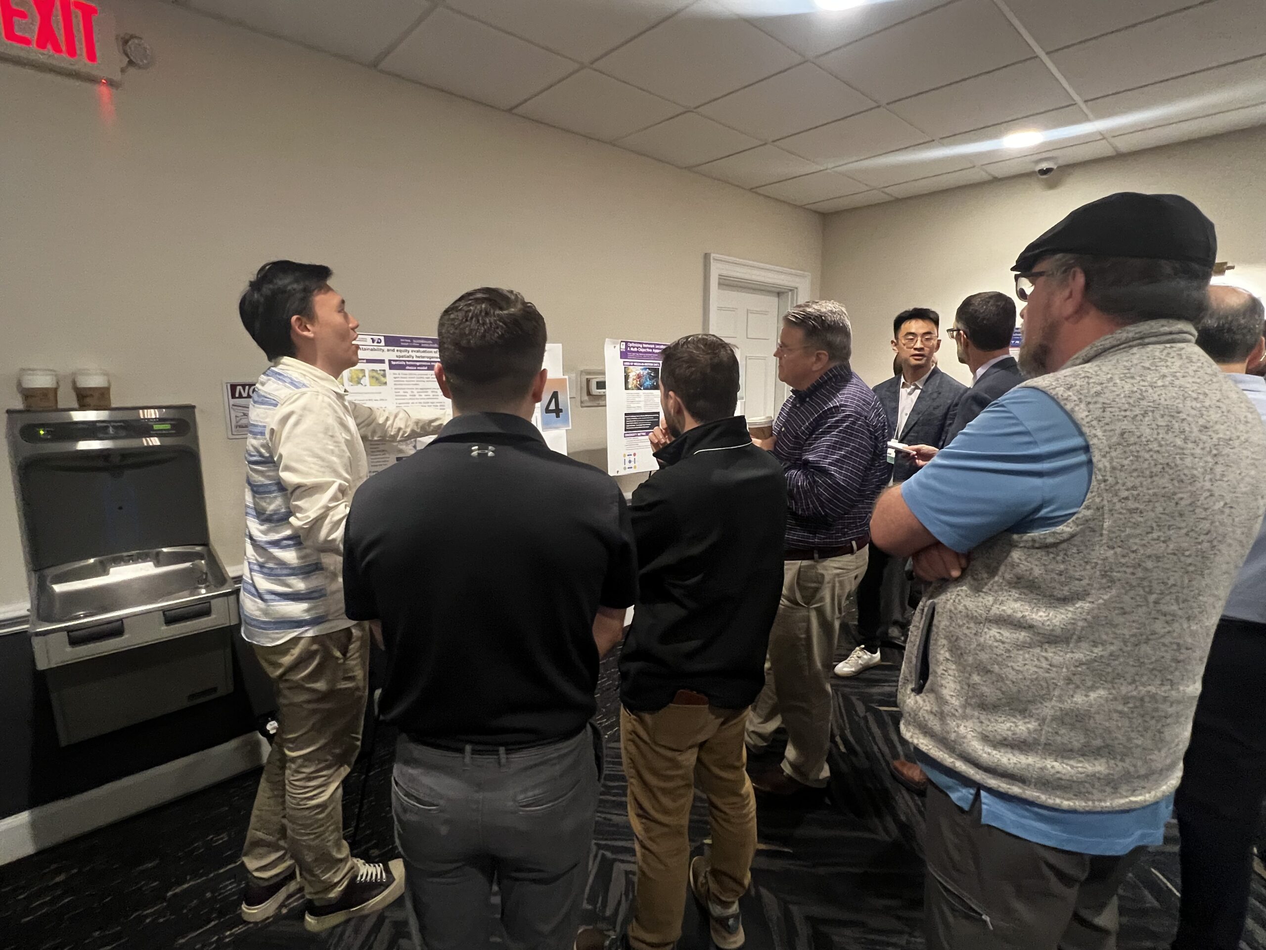 student researchers during the poster presentation