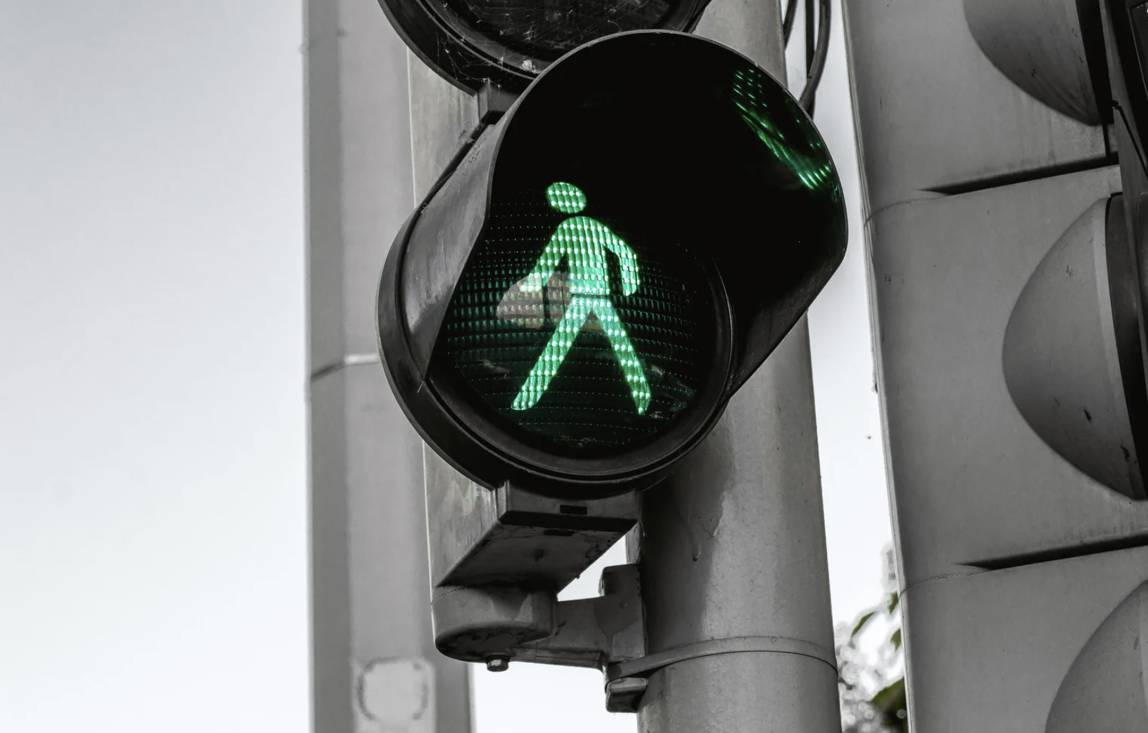 green pedestrian traffic sign