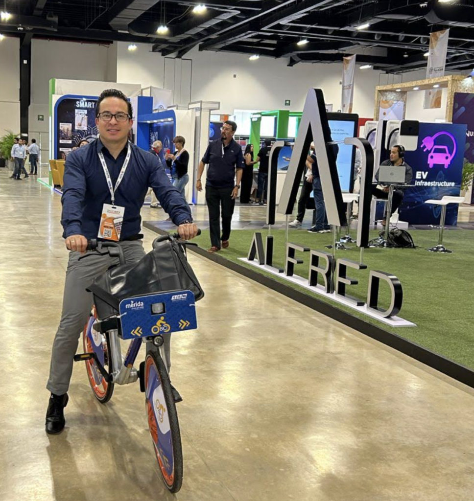 Diego on a bike at an expo