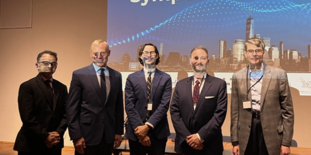 groupshot of a panel on stage