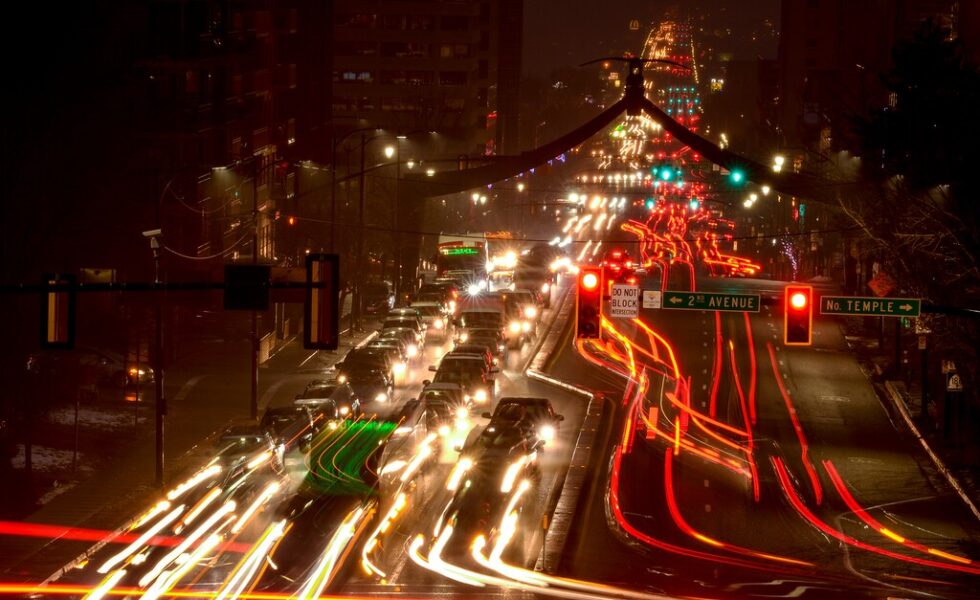 nighttime busy street and traffic light