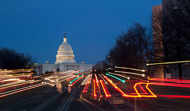 United States capitol at night with car streaks