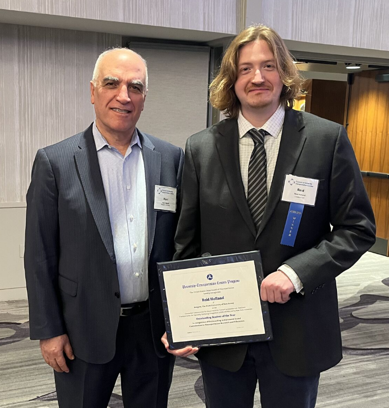 Reid Holland and Rutgers Prof. Hani Nassif posing with Reid's Student of the Year award