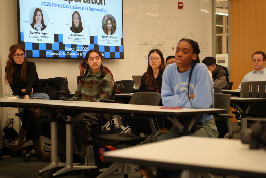 student audience member asking a question of the WIT panelists.